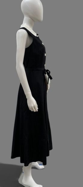 AGNES B. 
Long, sleeveless black cotton dress...