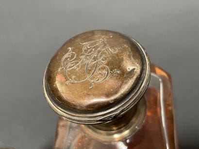 Set of four glass bottles with silver mounts...
