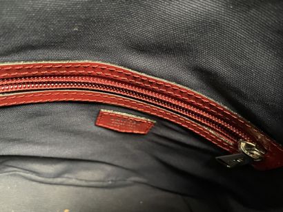 LANCEL
Red embossed leather bucket bag with...
