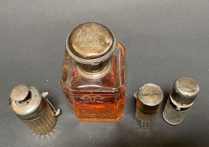 Set of four glass bottles with silver mounts...