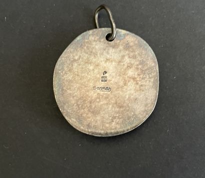 Four metal pendants, 
including “St. Francis...
