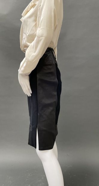 RALPH LAUREN
Black wool skirt accented with...