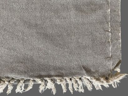 MADURA
Two plaids, one in mottled gray cotton,...