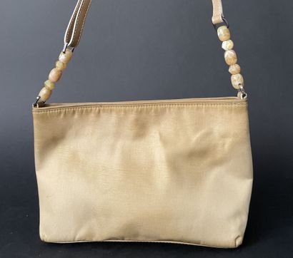 Christian DIOR
Beige nylon bag with magnetic...