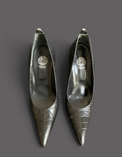 VERSACE 
Pair of black leather pumps with...