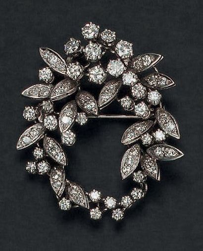 Broche faisant pendentif en or blanc 18K...