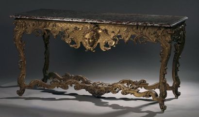 Table console en bois sculpté et doré à décor...