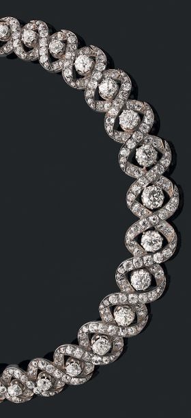 Collier souple en or jaune 18K (750) et argent,...