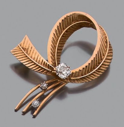 Broche en or jaune 18K (750), stylisée d'un...