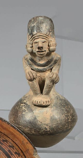 Ceremonial ocarina shaped like a seated chief,...