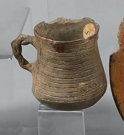 Decreasing jug with braided handle, decorated...