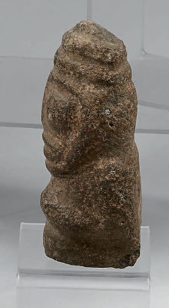 Anthropomorphic idol carved with a face with...