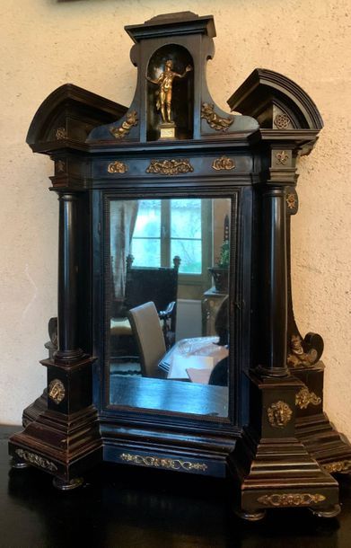 Reliquary in blackened wood, the broken pediment...