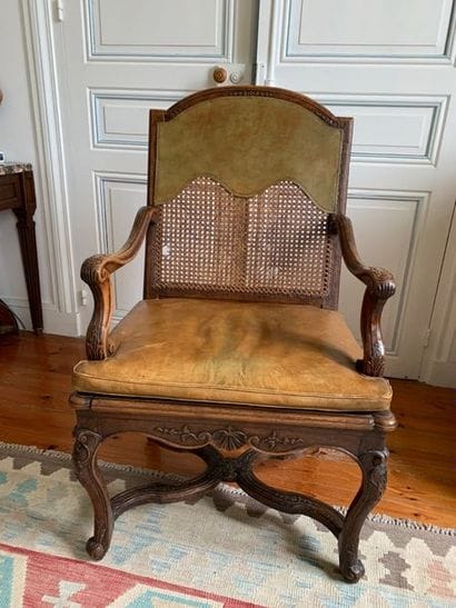 Armchair in moulded fruitwood carved with...