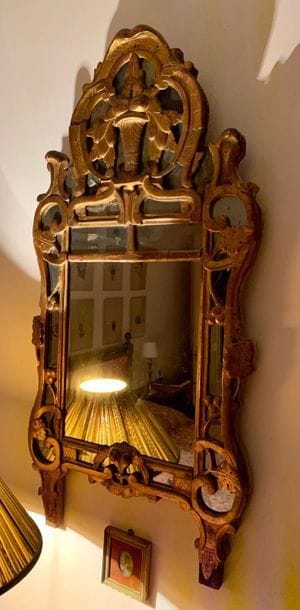 Mirror with a gilded wood frame with beaded...