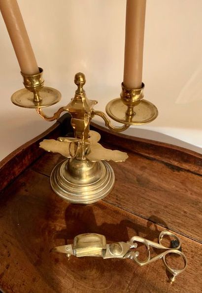 Brass hand candlestick with two lights.
Missing.
It...