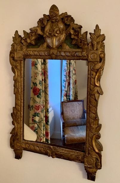 Mirror with a green and gilded painted wood...
