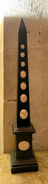 Pair of blackened wood obelisks applied on...