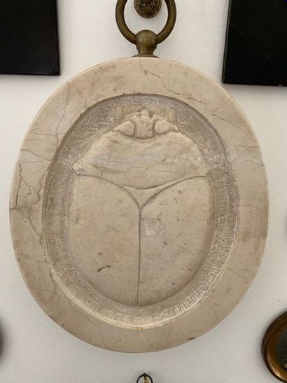 Oval marble medallion carved in bas-relief...