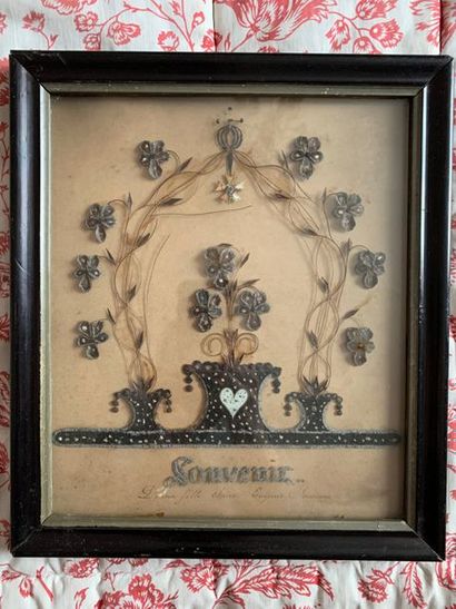 Hair and fiber embroidery representing a...