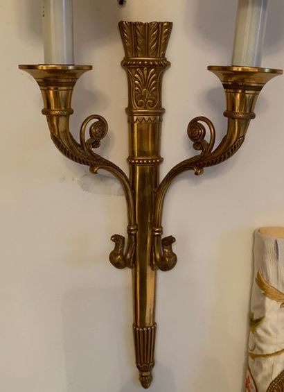Pair of gilt bronze sconces, the shaft in...