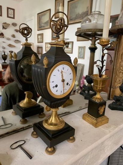 Pendulum in patinated and gilded bronze,...