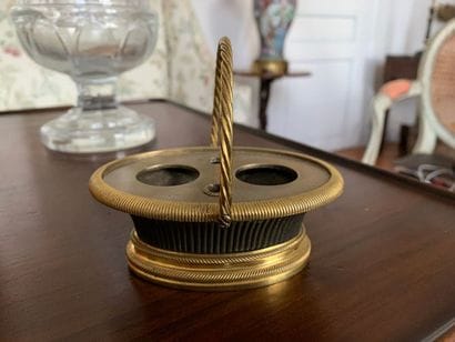 Oval desk inkwell in patinated and gilt bronze...