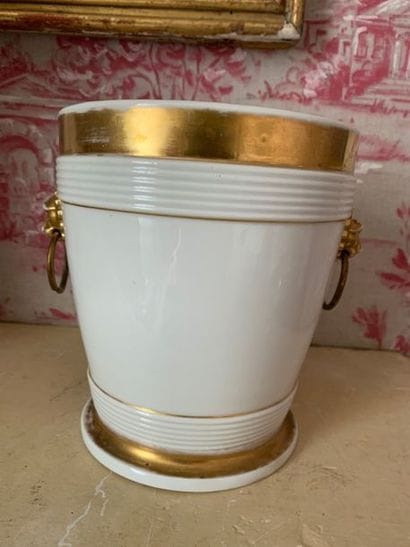 A white porcelain planter and its display...