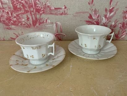 Pair of white porcelain cups and two saucers...