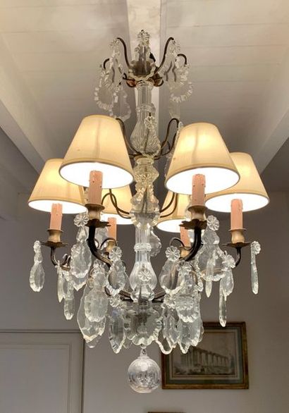 Chandelier with patinated metal frame decorated...