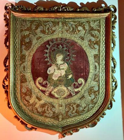 Two hanging processional banners, one depicting...
