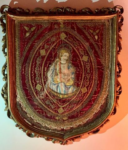 Two hanging processional banners, one depicting...