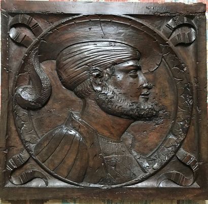 Fruitwood panel carved with a man's profile...