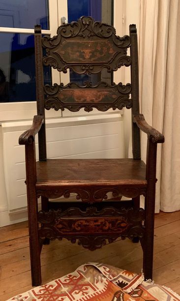 Fruitwood armchair with a dark patina, the...