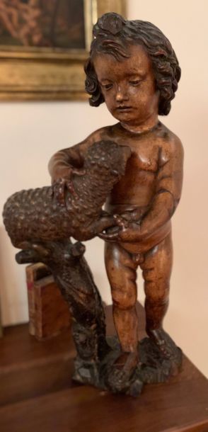 Carved wooden statue representing the naked...