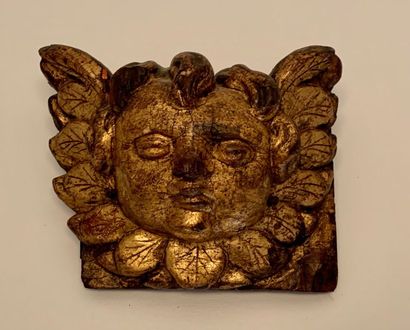 Carved and gilded wooden element featuring...