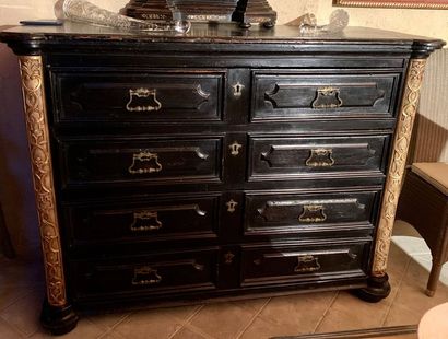 Blackened wood chest of drawers moulded with...