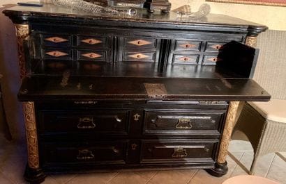 Blackened wood chest of drawers moulded with...
