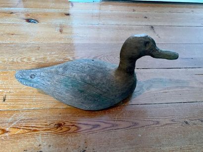 Natural wooden decoy showing a duck.
Height:...
