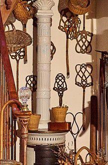 Set of thirteen beaters with curved rattan...
