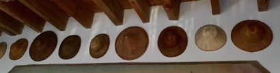 Set of twelve straw and rush hats, in colonial...