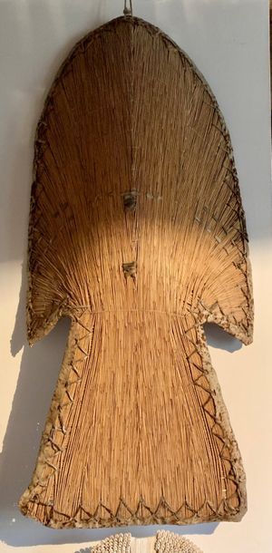 Shield made of braided rush, curved and trapezoidal...