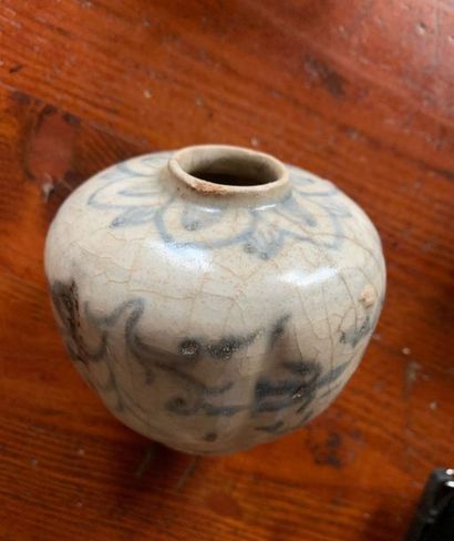 Small cracked ceramic vase with blue decoration...