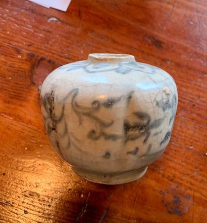 Small cracked ceramic vase with blue decoration...
