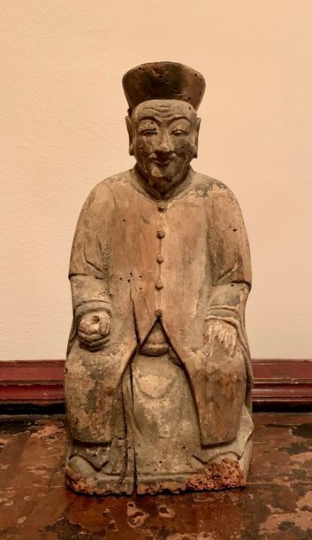 Statue of a character wearing a wooden beret...