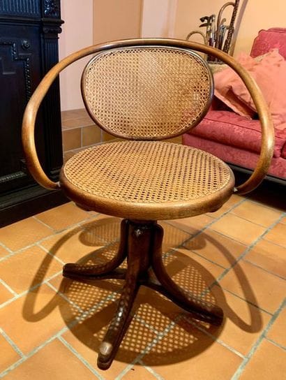 Curved wooden office armchair, the swivel...