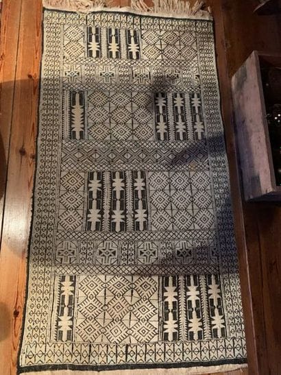 Two kilim carpets, one with stripes in pinkish...