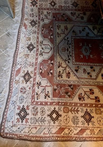 Large oriental wool carpet with beige background....