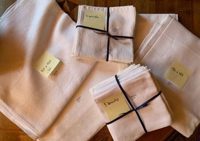 Set of four white damask tablecloths.
190...