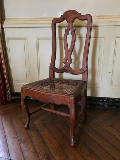 A suite of four chairs in stained fruitwood,...